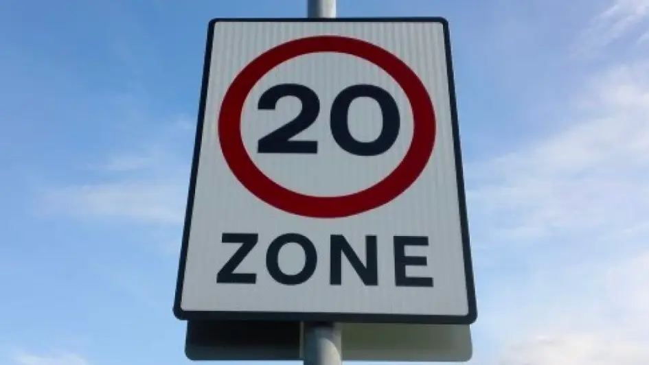 A road sign that depicts a speed limit of 20 mph